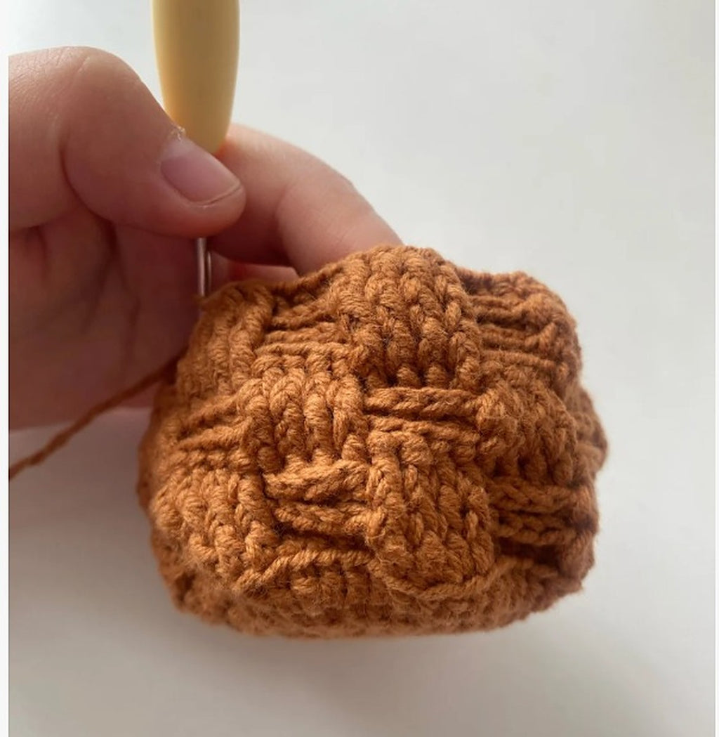 Brown crochet basket with basketweave texture